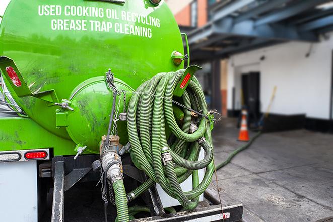 heavy-duty vacuum truck pumping out a grease trap in Antelope, CA