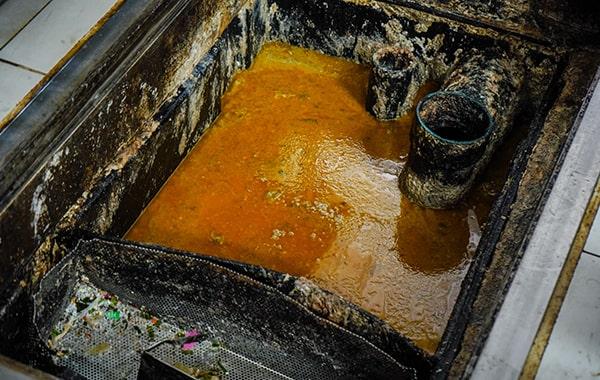 it's recommended to hire specialists for grease trap cleaning due to the specialized equipment and knowledge required